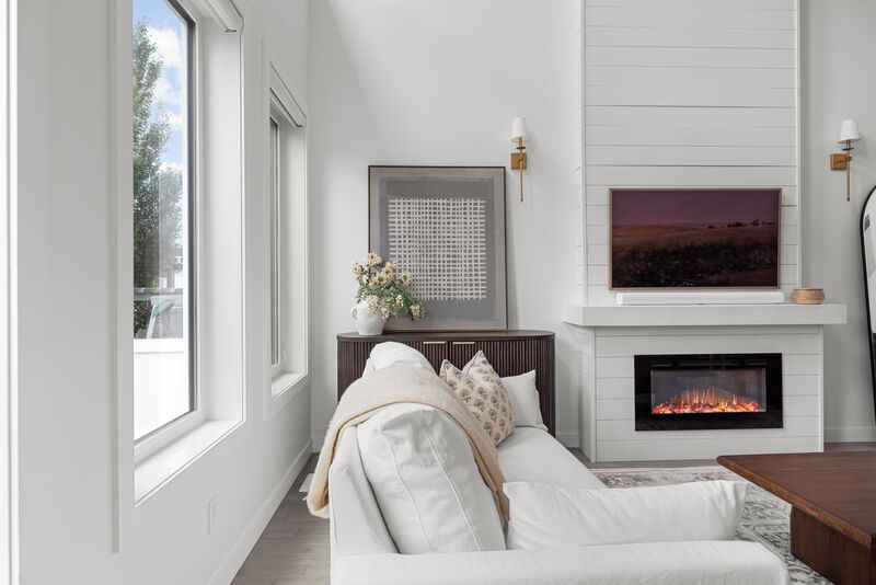 Living room with fireplace and vaulted ceiling