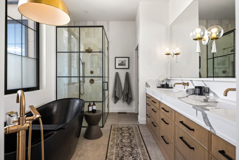 Primary ensuite bathroom with freestanding tub and walk-in glass shower