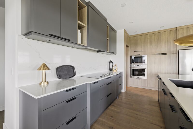 Kitchen with quartz countertops and built-in appliances
