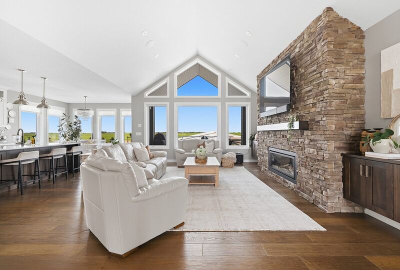 Living room with fireplace and floor-to-ceiling windows